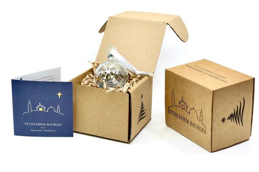 Ice Blue recycled glass Bethlehem Bauble painted with white snowflake hanging on white ribbon